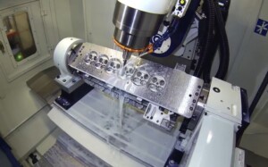 CNC milling of automotive engine part, showing precision machining, smooth surface finish, and high-quality metal component manufacturing