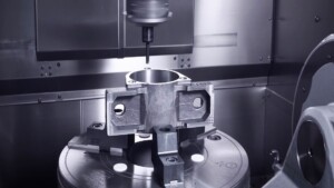 5-axis CNC machining center working on complex metal part