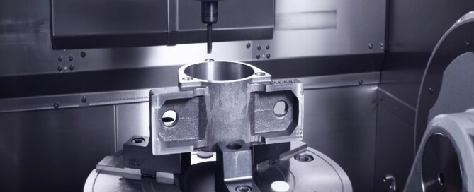 5-axis CNC machining center working on complex metal part